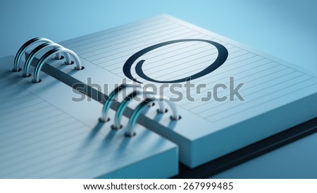 Closeup of a personal agenda, organizer or planner, setting an important date, marking a day of the month representing a organizing time and schedule.