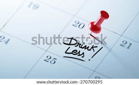 Concept image of a Calendar with a red push pin. Closeup shot of a thumbtack attached. The words Drink Less written on a white notebook to remind you an important appointment.