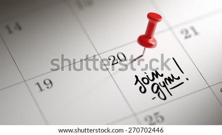 Concept image of a Calendar with a red push pin. Closeup shot of a thumbtack attached. The words Join GYM written on a white notebook to remind you an important appointment.