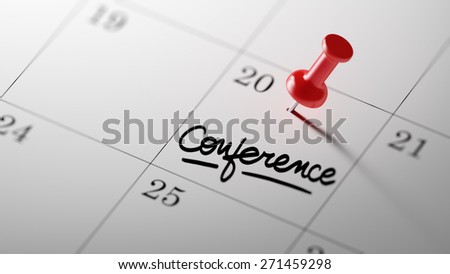 Concept image of a Calendar with a red push pin. Closeup shot of a thumbtack attached. The words Conference written on a white notebook to remind you an important appointment.