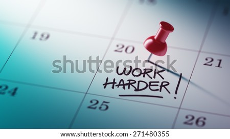 Concept image of a Calendar with a red push pin. Closeup shot of a thumbtack attached. The words Work Harder written on a white notebook to remind you an important appointment.