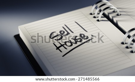 Closeup of a personal agenda setting an important date representing a time schedule. The words Sell House written on a white notebook to remind you an important appointment.