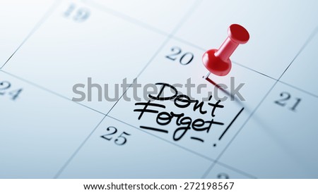 Concept image of a Calendar with a red push pin. Closeup shot of a thumbtack attached. The words Don`t Forget written on a white notebook to remind you an important appointment.