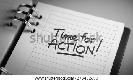 Closeup of a personal agenda setting an important date representing a time schedule. The words Time for action written on a white notebook to remind you an important appointment.