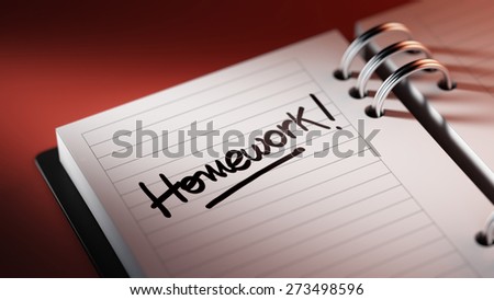 Closeup of a personal agenda setting an important date representing a time schedule. The words Homework written on a white notebook to remind you an important appointment.