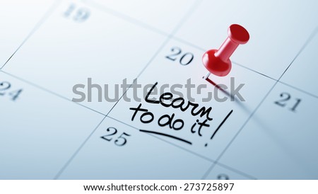 Concept image of a Calendar with a red push pin. Closeup shot of a thumbtack attached. The words Learn to do it written on a white notebook to remind you an important appointment.