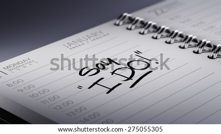 Closeup of a personal calendar setting an important date representing a time schedule. The words Say \