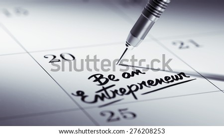 Concept image of a Calendar with a golden dart stick. The words Be an entrepreneur written on a white notebook to remind you an important appointment.