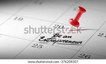 Concept image of a Calendar with a red push pin. Closeup shot of a thumbtack attached. The words Be an entrepreneur written on a white notebook to remind you an important appointment.