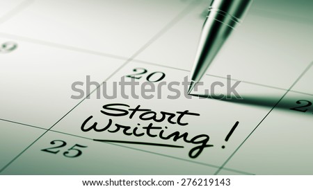 Closeup of a personal agenda setting an important date written with pen. The words Start Writing written on a white notebook to remind you an important appointment.