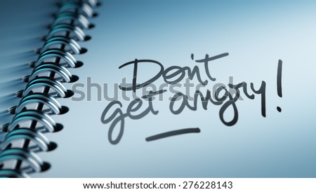 Closeup of a personal calendar setting an important date representing a time schedule. The words Don\'t get angry written on a white notebook to remind you an important appointment.