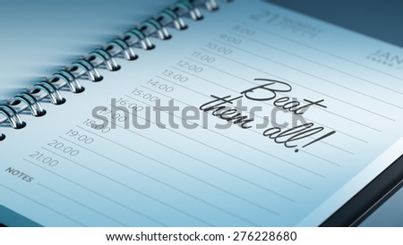Closeup of a personal calendar setting an important date representing a time schedule. The words Beat them all written on a white notebook to remind you an important appointment.