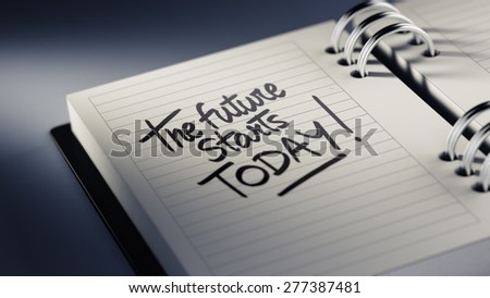 Closeup of a personal agenda setting an important date representing a time schedule. The words The future starts today written on a white notebook to remind you an important appointment.