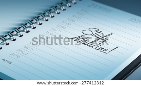 Closeup of a personal calendar setting an important date representing a time schedule. The words Study Medicine written on a white notebook to remind you an important appointment.