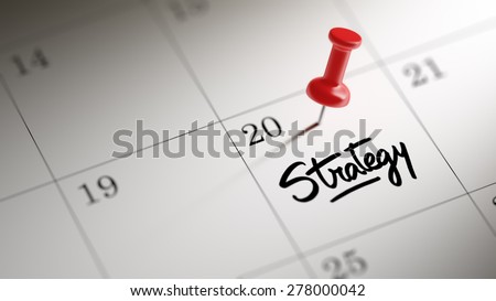 Concept image of a Calendar with a red push pin. Closeup shot of a thumbtack attached. The words Strategy written on a white notebook to remind you an important appointment.