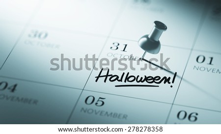 Concept image of a Calendar with a push pin. Closeup shot of a thumbtack attached. The words Halloween written on a white notebook to remind you an important appointment.