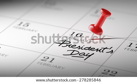 Concept image of a Calendar with a red push pin. Closeup shot of a thumbtack attached. The words President\'s Day written on a white notebook to remind you an important appointment.