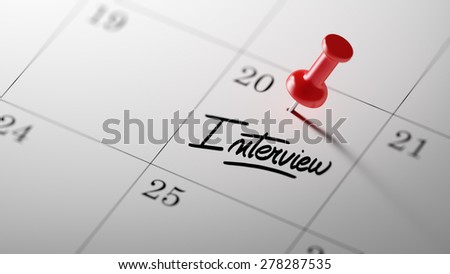 Concept image of a Calendar with a red push pin. Closeup shot of a thumbtack attached. The words Interview written on a white notebook to remind you an important appointment.