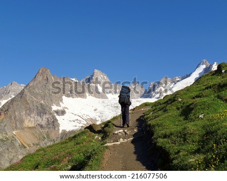 Western Alps, Italian Alps, French Alps, hiker with view to the Mont Blanc massif from the italian side