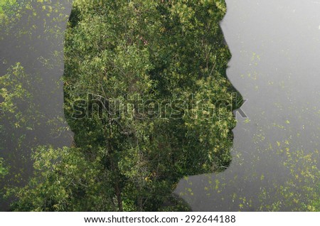 Double exposure image of man face.multiply with trees photo concept.
