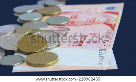 Singapore Coins on a bed of Notes