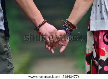 Two hands gently pull together