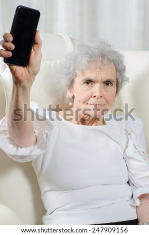 old woman wants to throw away her smart phone