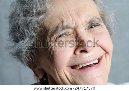 Portrait laughing old woman - close up
