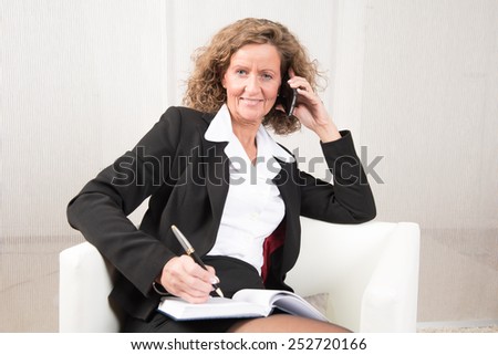 female Boss talking to someone and being happy