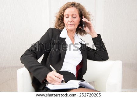 female Boss talking to someone on the phone
