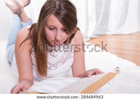 Student learning lying on a blanket