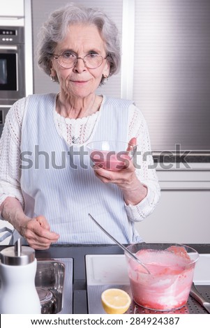 active female  senior in kitchen