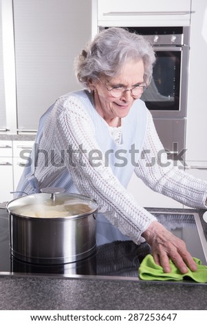 active female senior in kitchen