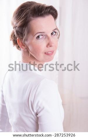 attractive woman looking over shoulder