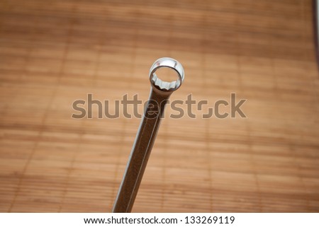 Open End Wrench on wooden underlay