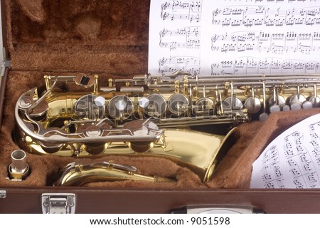 Saxophone in case and notes