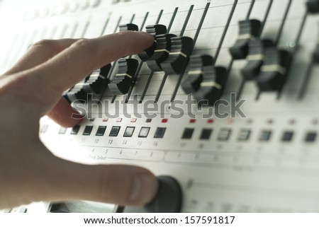 Hand Of Dj Tweaking Knobs And Moving Sliders On Mixer, Modern Way Of Creating Music