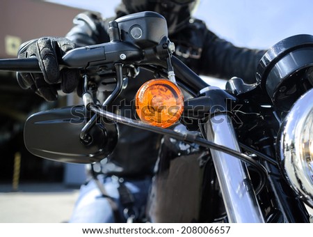 hand of a biker on a throttle control