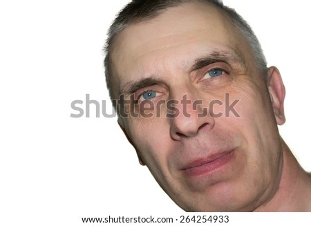 Studio shot of a dreamily looking man with a tilted head, isolated on white