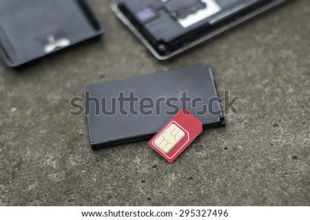 Lost sim card and mobile phone, concept of security of personal data, shallow depth of field shot