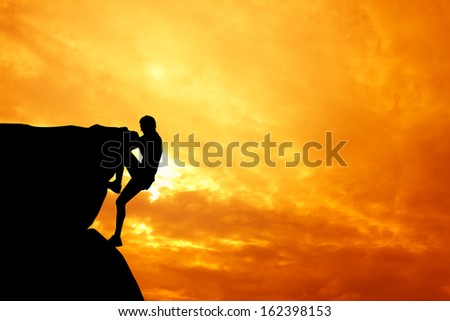 Free climbing man at sunset Free climbing man at sunset
