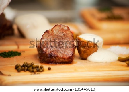 grilled meat cooked on board