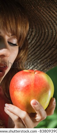 girl ready to eat apple. outdoor portrait