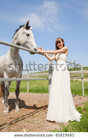 attractive girl and horse. outdoor shot