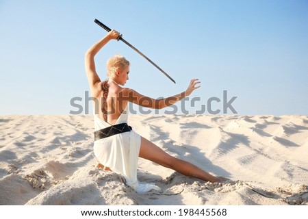 militant girl with sword in morning light