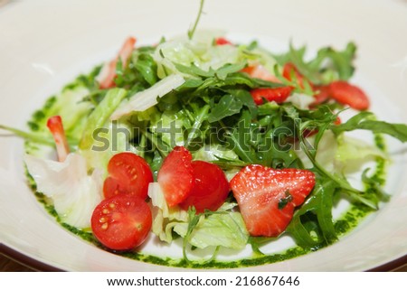 fresh salad with cherry tomatoes and strawberries