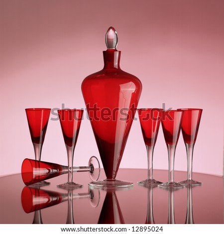 red glasses and bottle on a mirror