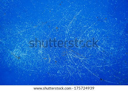 Old cracked paint pattern on rusty background. Peeling paint. Pattern of rustic blue grunge material. Damaged paint on the metal surface. Scratched old metal plate