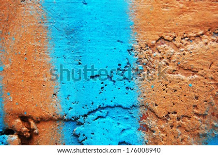 paint wall color background blue orange real texture. Background of old orange painted wall