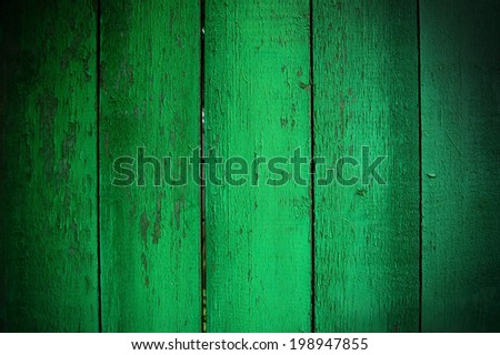Wooden Palisade background. Close up of green wooden fence panels. Old wooden fence. wood texture background. wood fence background